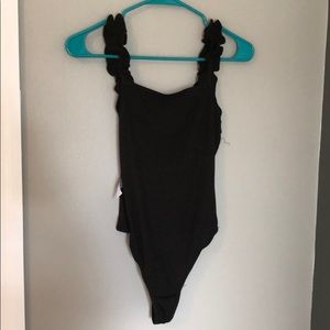 Black ruffle body suit never worn